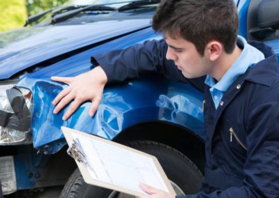 man inspecting the car