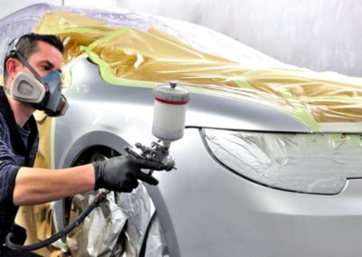 man painting the car