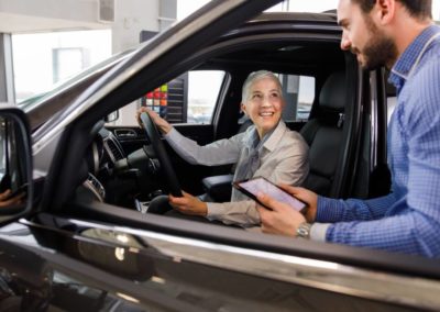 smiling woman after receiving the car