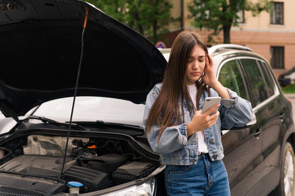 worried-damage woman calling for car towing